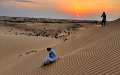sand boarding abu dhabi desert goldern hour